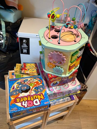 Kids table and chairs and mix of toys and books all have to go together