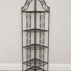 Black metal corner shelving unit