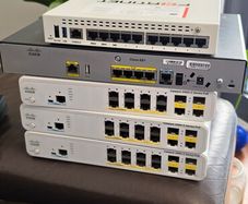 Cisco router 800, switches x 3 2960s 8 port, 1 fortinet firewall (without power cable)