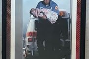Framed Motivational Pride Photo showing ambulance crew with baby.