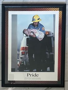 Framed Motivational Pride Photo showing ambulance crew with baby.
