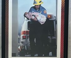 Framed Motivational Pride Photo showing ambulance crew with baby.