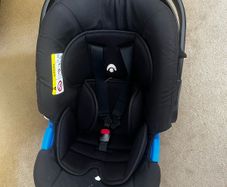 Next to me and car seat