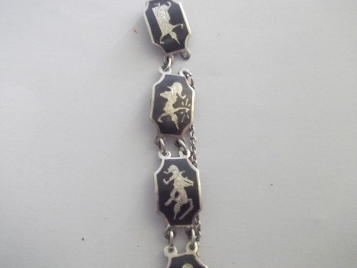 a vintage silver and enamel bracelet