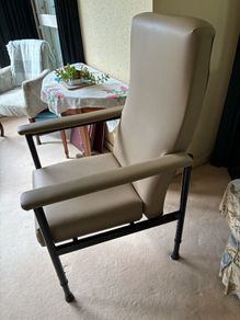 Adjustable high backed chair for an elderly person