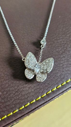 NEW - Silver butterfly necklace and stud earrings