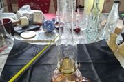 Beautiful Old Glass Thumb Oil Lamp It features a Tall Slender Glass Chimney designed to protect the flame and improve combustion Postage Available