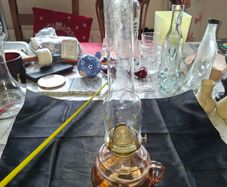 Beautiful Old Glass Thumb Oil Lamp It features a Tall Slender Glass Chimney designed to protect the flame and improve combustion Postage Available