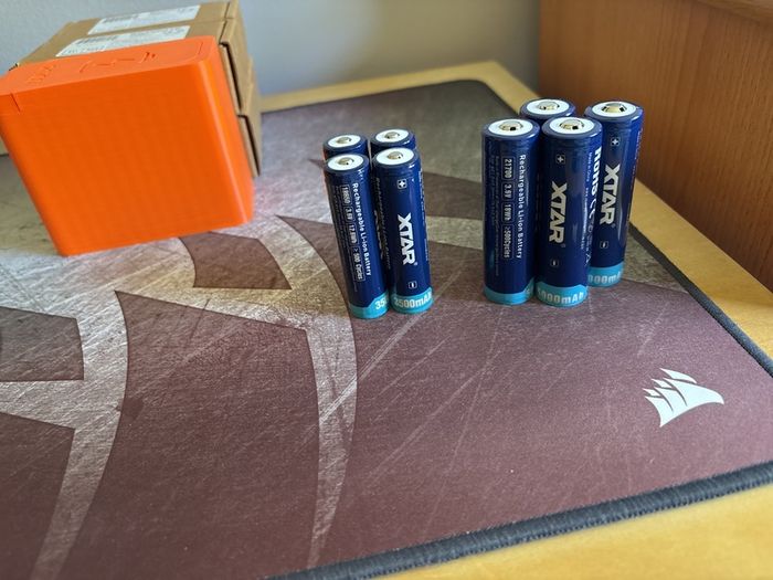 Four 18650 and 21700 Xtar button top batteries