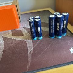 Four 18650 and 21700 Xtar button top batteries