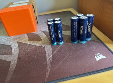 Four 18650 and 21700 Xtar button top batteries