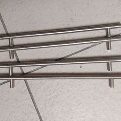 Long metal handles from wardrobe