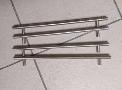 Long metal handles from wardrobe