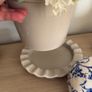 Beige pot with faux flowers Image 4