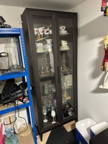 Tall glass and wood cabinet