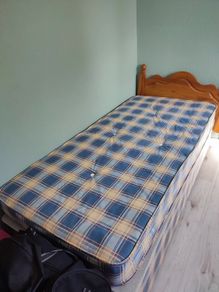 Single bed with pine headboard