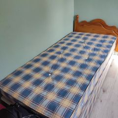 Single bed with pine headboard