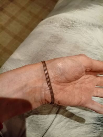 Silver tone bracelet with ball clasp