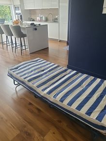 Fold away bed with mattress