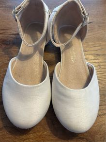 White satin occasion shoe with ankle strap and low heal
