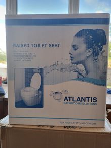 Raised toilet seat