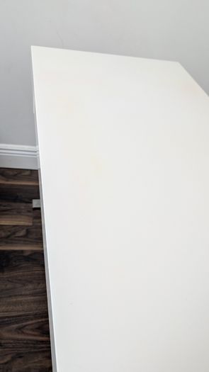 Modern white desk with chrome cross legs