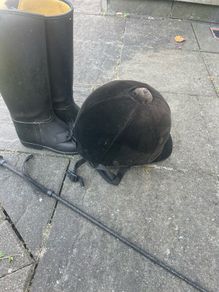 Childs horse riding helmet, boots and whip
