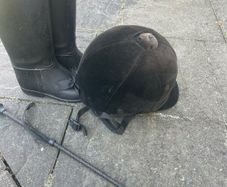 Childs horse riding helmet, boots and whip