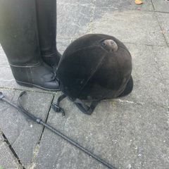Childs horse riding helmet, boots and whip