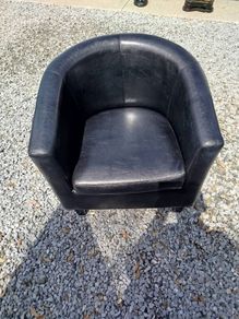 Black leather tub chair with black legs
