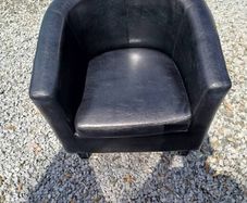 Black leather tub chair with black legs
