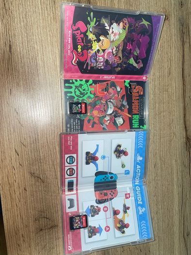 Nitendo switch, including 2 games, splatoon 2 & Mario kart deluxe and accessories too.