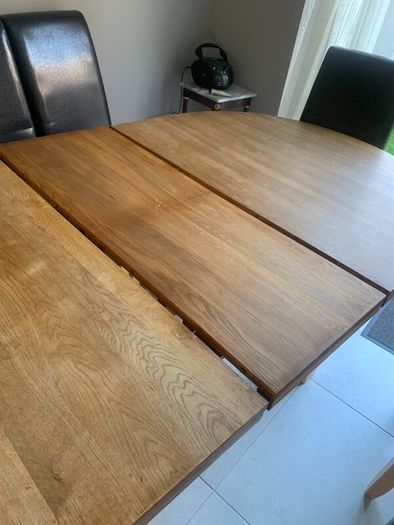 Solid extendable oak table- very good in