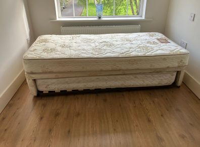 Single bed with pullout bed underneath