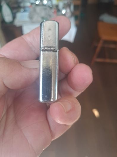 Champ Flip top petrol lighter.