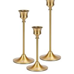 Set of 3 brass colored candle holders