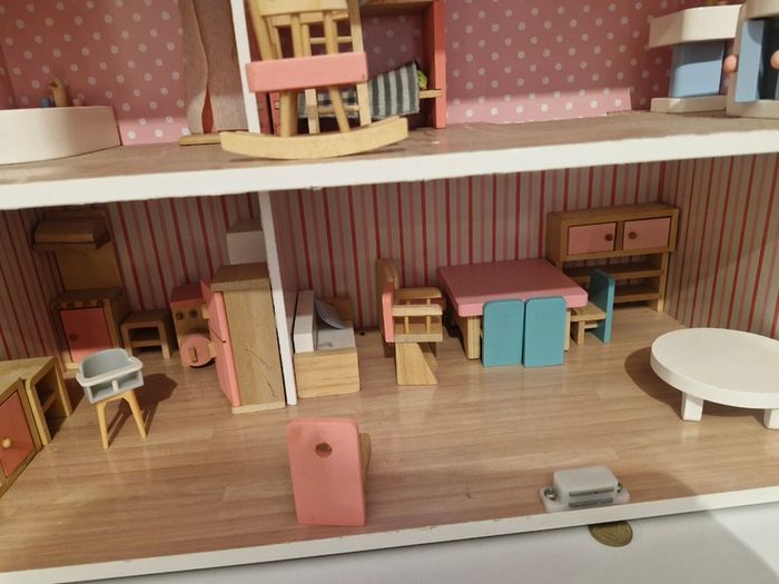 Wooden dolls house with furniture