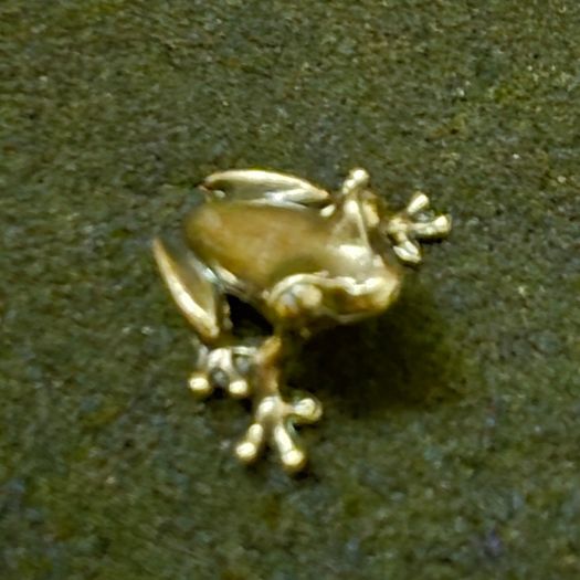 3 brass frogs.