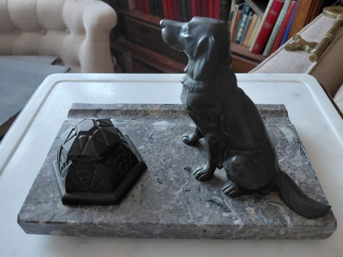 Antique desk inkwell with a seated dog on marble stand