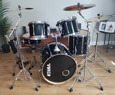 Tama 5-piece black Drum Kit with Zildjian cymbals and drum cases.
