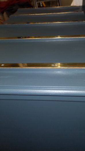 Chest drawers with brass strip suitcase set down