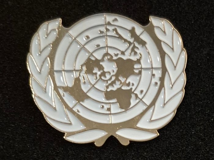 United nations, peacekeeping cap badge.