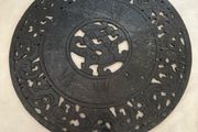 Carved  stone disc