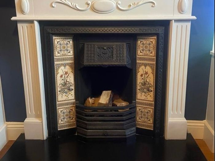 cast iron fireplace with timber surround