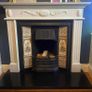 cast iron fireplace with timber surround Image 2