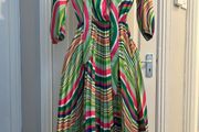 Brand new dress still with tag. Free size , will fit up to size 12