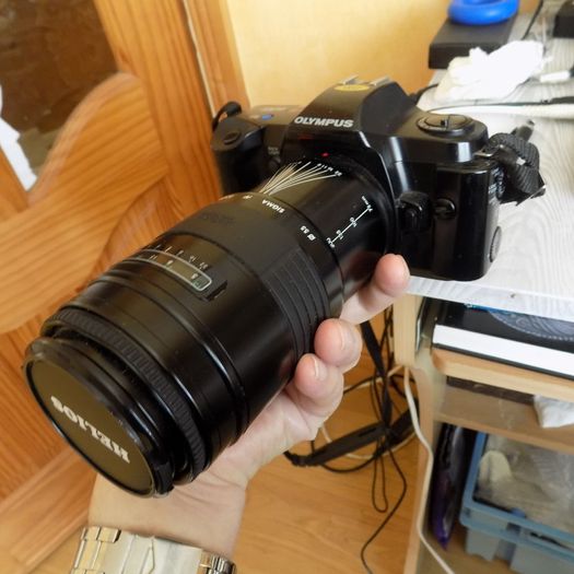 Old heavy Olympus OM101 Camera with lens.