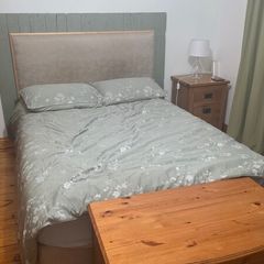 double bed with mattress and headboard