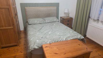 double bed with mattress and headboard