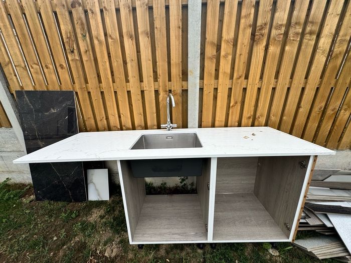 Narrow Sink Along With Vanity Unit And Pipes; Kitchen Sink And Quartz Worktop Unit With Wooden Inparts